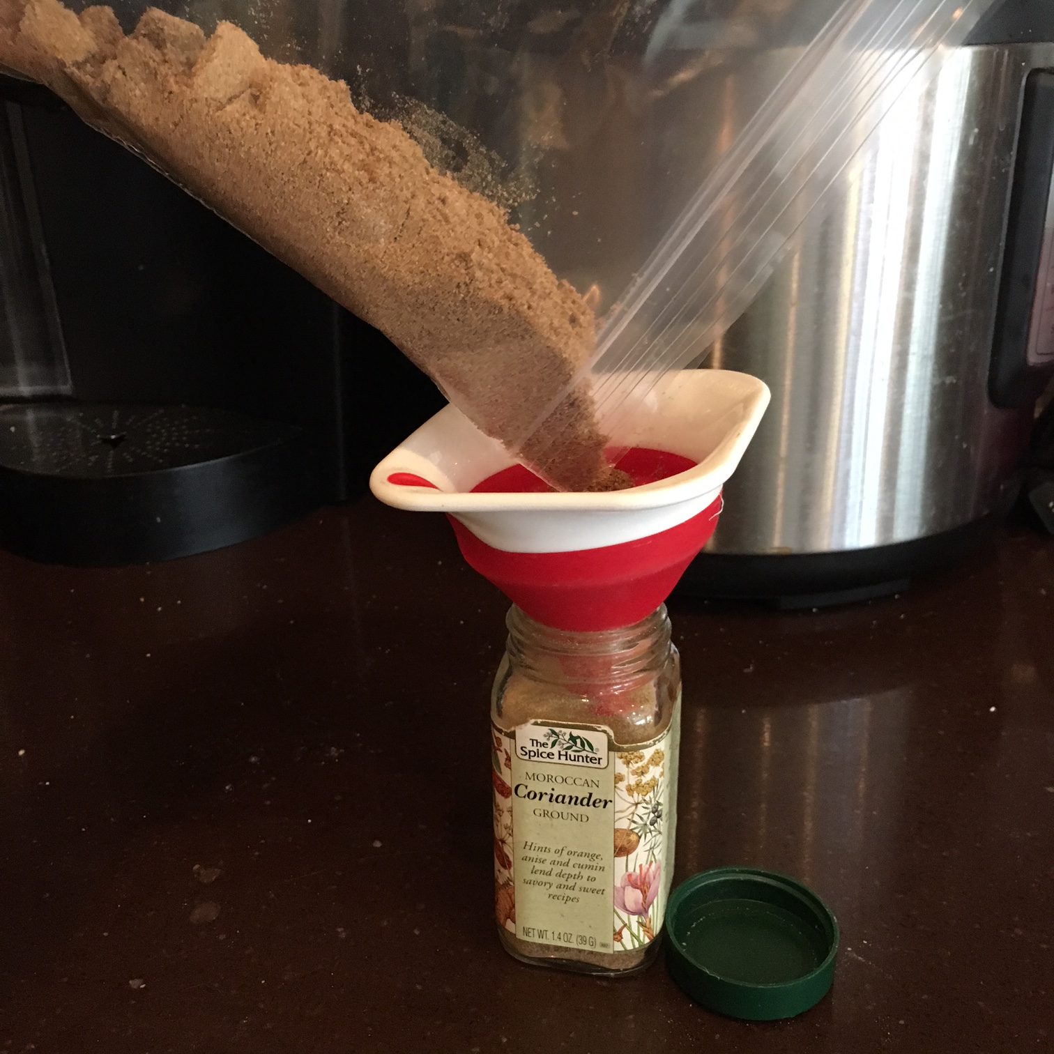 Refilling a spice jar from the bulk bin